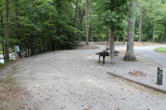 Gravel site with table, fire pit, grill
