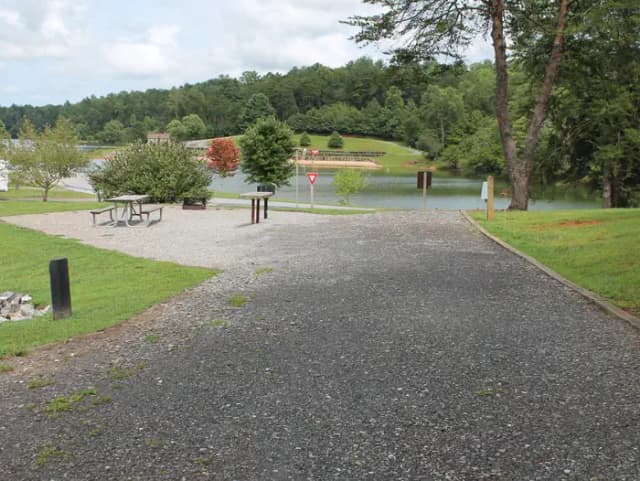 Long gravel pull in with fire pit, table, grill on site  and views of the lake