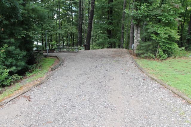 Gravel site with table, fire pit, grill