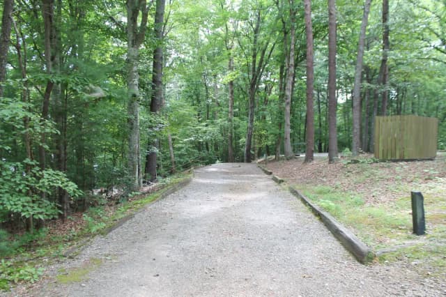 Gravel site with fire pit, table, grill