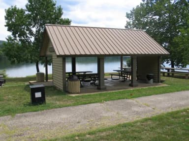 Chapel Hill group shelter showing multiple picnic tables and group grill.