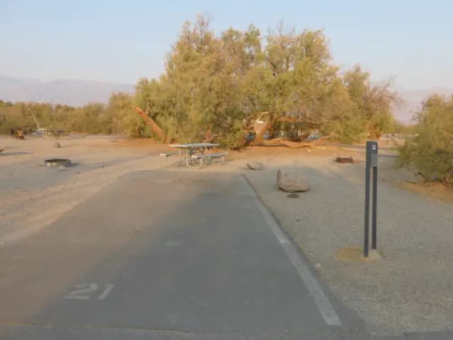 Furnace Creek Campground standard nonelectric site #21 with picnic table and fire ring.
