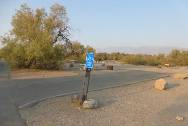 Furnace Creek Campground standard nonelectric ADA site #22 with accessible picnic table and fire ring.