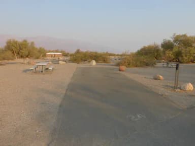 Furnace Creek Campground standard nonelectric site #24 with picnic table and fire ring.
