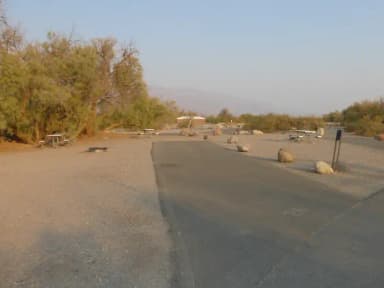 Furnace Creek Campground standard nonelectric site #26 with picnic table and fire ring.