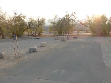 Furnace Creek Campground standard nonelectric site #27 with picnic table and fire ring.