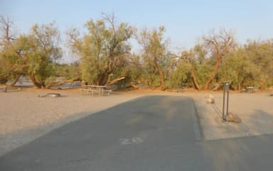 Furnace Creek Campground standard nonelectric site #28 with picnic table and fire ring.