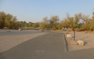 Furnace Creek Campground standard nonelectric site #29 with picnic table and fire ring.