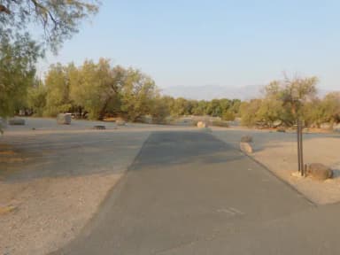 Furnace Creek Campground standard nonelectric site #31 with picnic table and fire ring.