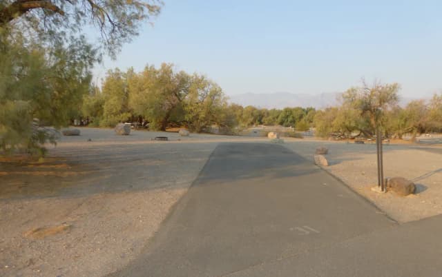 Furnace Creek Campground standard nonelectric site #31 with picnic table and fire ring.
