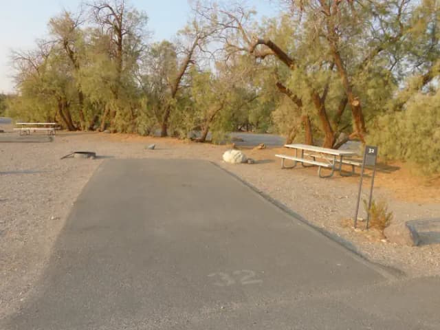 Furnace Creek Campground standard nonelectric site #32 with picnic table and fire ring.