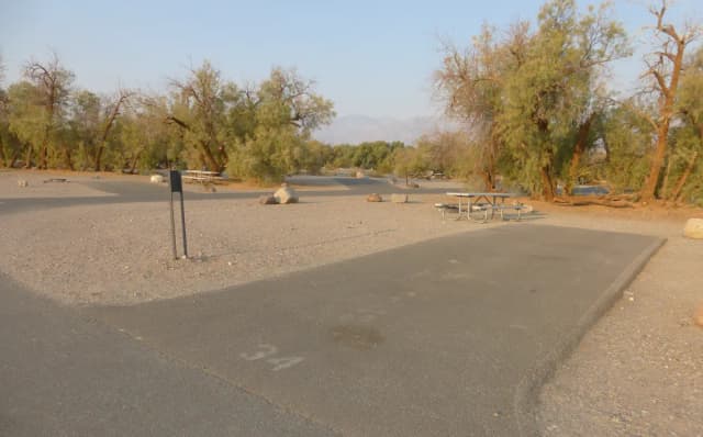 Furnace Creek Campground standard nonelectric site #34 with picnic table and fire ring.