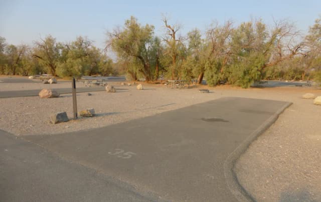 Furnace Creek Campground standard nonelectric site #35 with picnic table and fire ring.