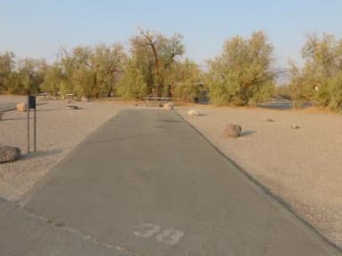 Furnace Creek Campground standard nonelectric site #38 with picnic table and fire ring.