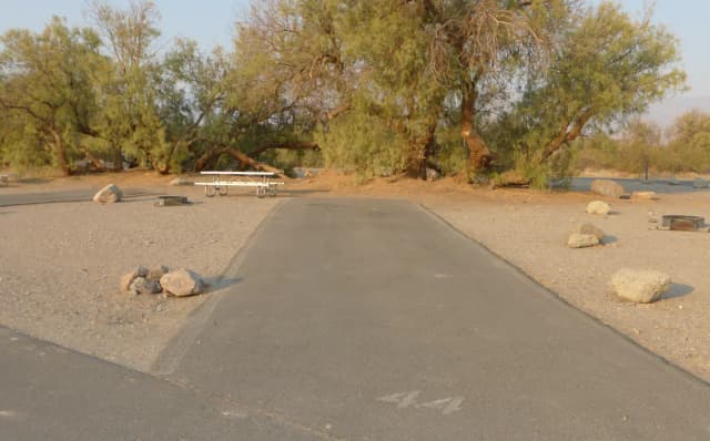 Furnace Creek Campground standard nonelectric site #44 with picnic table and fire ring.