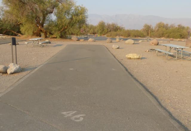 Furnace Creek Campground standard nonelectric site #46 with picnic table and fire ring.
