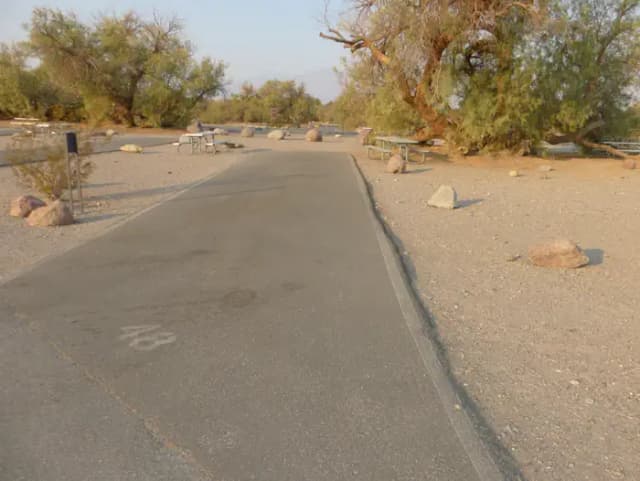 Furnace Creek Campground standard nonelectric site #48 with picnic table and fire ring.