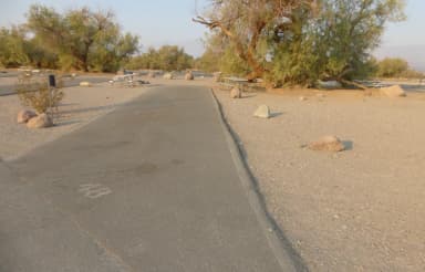 Furnace Creek Campground standard nonelectric site #48 with picnic table and fire ring.