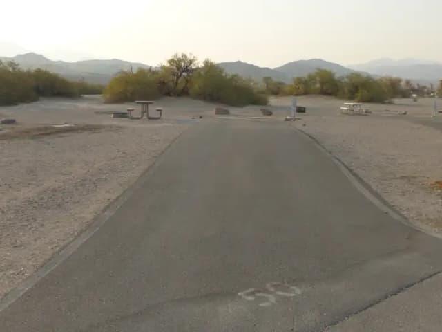 Furnace Creek Campground full hookup site #50. Water, sewer, and 30/50 amp electric connection. One fire pit and one picnic table.