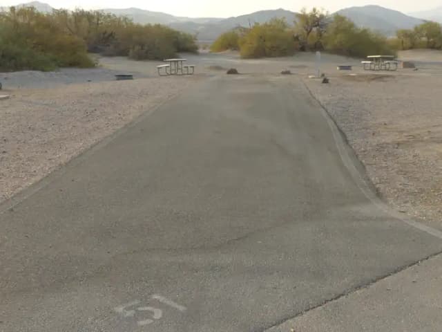 Furnace Creek Campground full hookup site #51. Water, sewer, and 30/50 amp electric connection. One fire pit and one picnic table.
