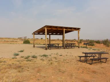 Lone Mesa Group Site A shade shelter and picnic tables.