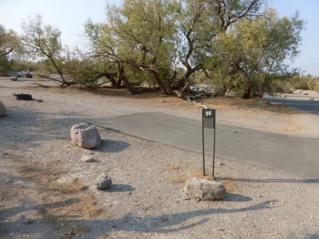 Furnace Creek Campground standard nonelectric site #56 with picnic table and fire ring.