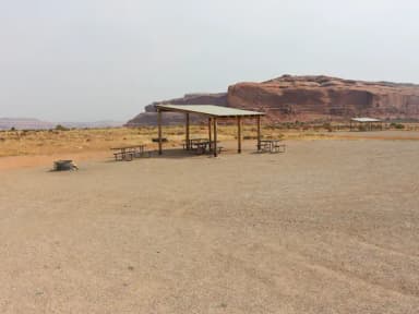 Lone Mesa Group Site C shade shelter, fire ring, and picnic tables.