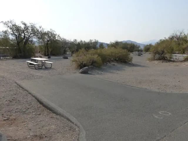 Furnace Creek Campground standard nonelectric site #60 with picnic table and fire ring.