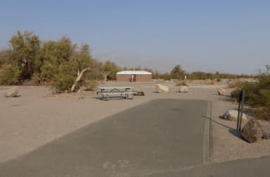 Furnace Creek Campground standard nonelectric site #62 with picnic table and fire ring.
