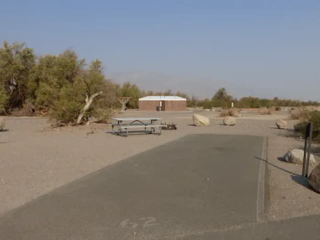 Furnace Creek Campground standard nonelectric site #62 with picnic table and fire ring.