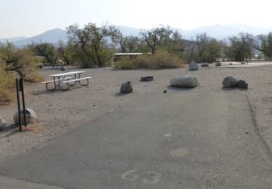 Furnace Creek Campground standard nonelectric site #63 with picnic table and fire ring.