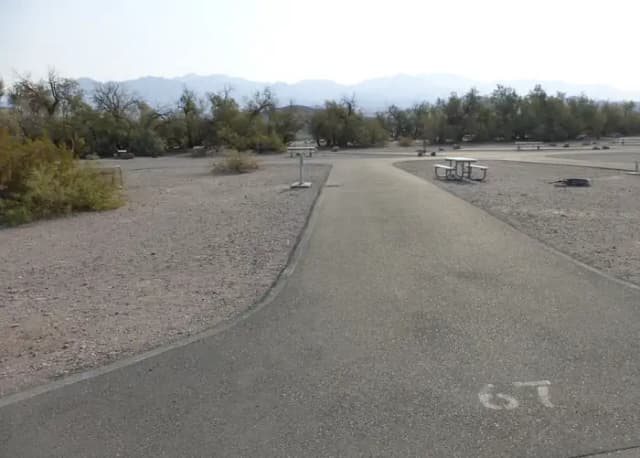 Furnace Creek Campground full hookup site #67. Water, sewer, and 30/50 amp electric connection. One fire pit and one picnic table.