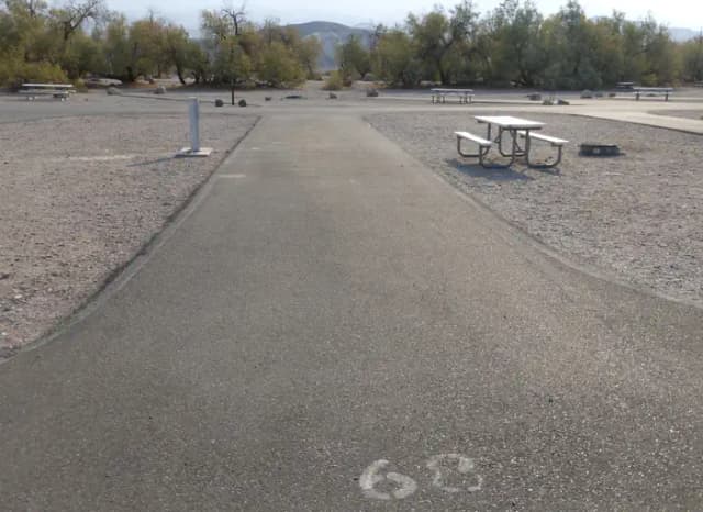 Furnace Creek Campground full hookup site #68. Water, sewer, and 30/50 amp electric connection. One fire pit and one picnic table.
