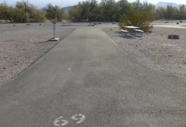 Furnace Creek Campground full hookup site #69. Water, sewer, and 30/50 amp electric connection. One fire pit and one picnic table.