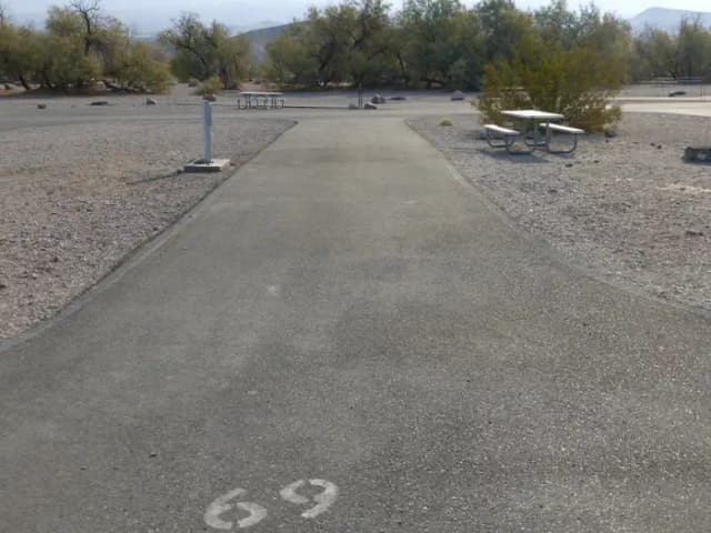 Furnace Creek Campground full hookup site #69. Water, sewer, and 30/50 amp electric connection. One fire pit and one picnic table.