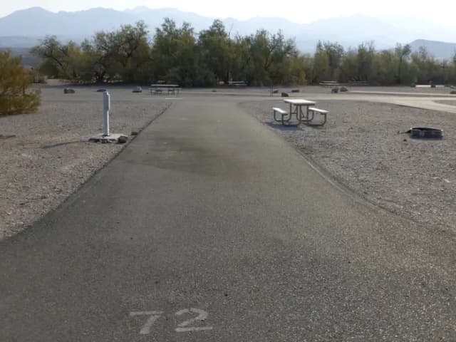 Furnace Creek Campground full hookup site #72. Water, sewer, and 30/50 amp electric connection. One fire pit and one picnic table.