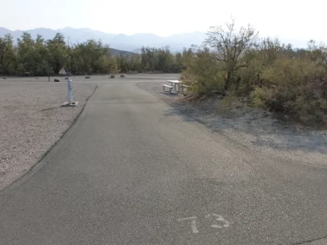 Furnace Creek Campground full hookup site #73. Water, sewer, and 30/50 amp electric connection. One fire pit and one picnic table.