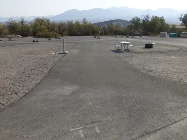 Furnace Creek Campground ADA full hookup site #77. Water, sewer, and 30/50 amp electric connection. One ADA accessible fire pit and picnic table.