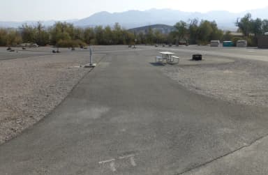 Furnace Creek Campground ADA full hookup site #77. Water, sewer, and 30/50 amp electric connection. One ADA accessible fire pit and picnic table.