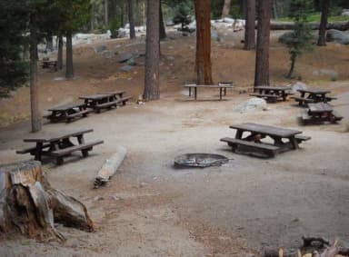 Campsite with benches with firepit.