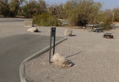Furnace Creek Campground standard nonelectric site #79 with picnic table and fire ring.