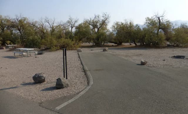 Furnace Creek Campground standard nonelectric site #80 with picnic table and fire ring.