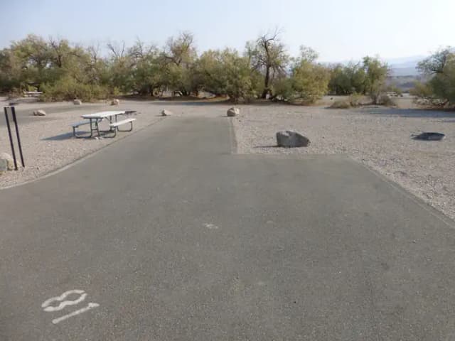 Furnace Creek Campground standard nonelectric site #81 with picnic table and fire ring.