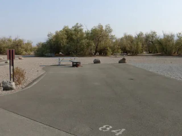 Furnace Creek Campground standard nonelectric ADA site #84 with accessible picnic table and fire ring.