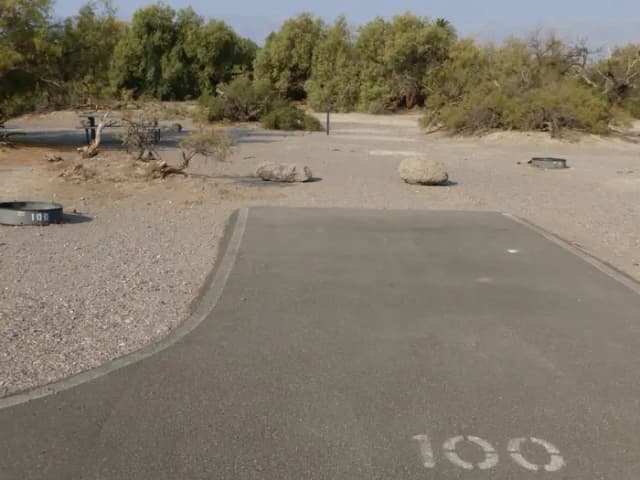Furnace Creek Campground standard nonelectric tent only drive in site #100 with picnic table and fire ring.