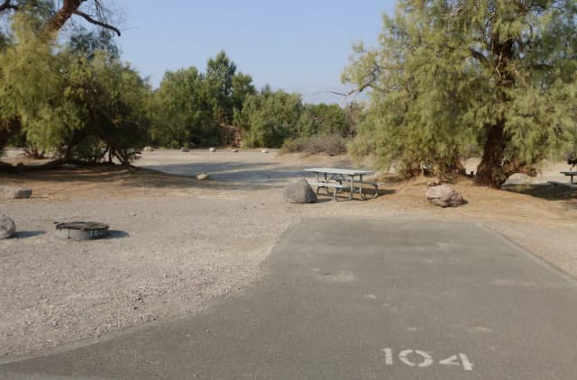 Furnace Creek Campground standard nonelectric tent only drive in site #104 with picnic table and fire ring.