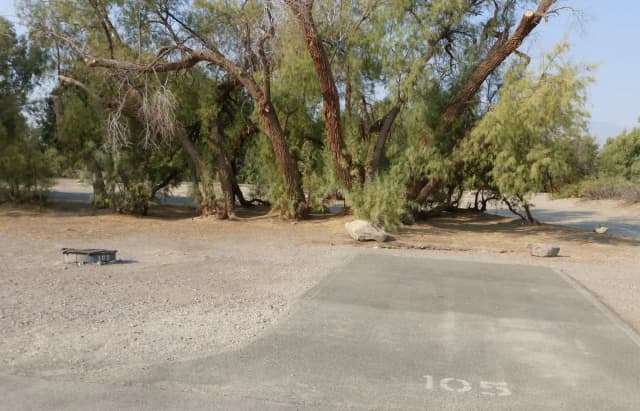 Furnace Creek Campground standard nonelectric tent only drive in site #105 with picnic table and fire ring.