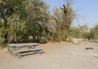 Furnace Creek Campground standard nonelectric tent only drive in site #106 with picnic table and fire ring.