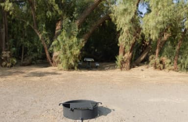 Furnace Creek Campground standard nonelectric tent only drive in site #108 with picnic table and fire ring.