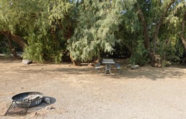 Furnace Creek Campground standard nonelectric tent only drive in site #109 with picnic table and fire ring.